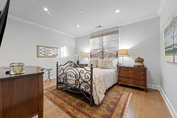a bedroom with bed and a window