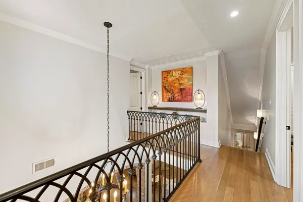 a view of hallway with wooden floor