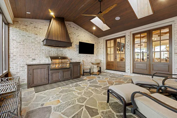 a room with furniture and flat screen tv