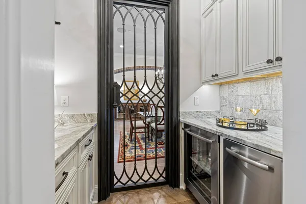 a kitchen with stainless steel appliances granite countertop a stove and a refrigerator