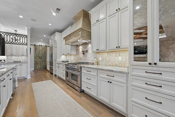 a large kitchen with cabinets