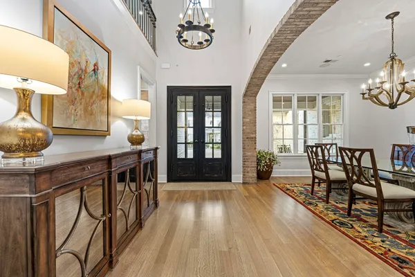 a view of a livingroom with furniture window and wooden floor