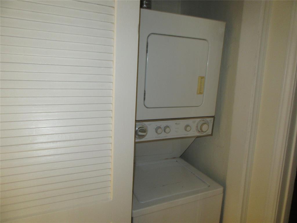 9737 Whitehurst Drive, Unit 39 Dallas, TX 75243 - Photo 4 of 5 a utility room with dryer and washer