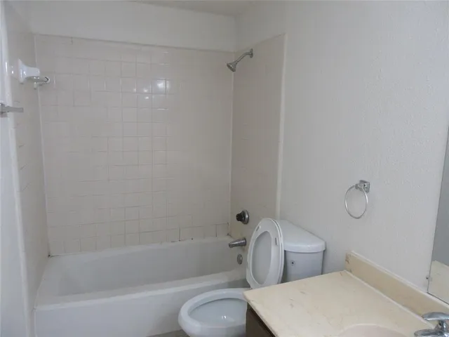 a bathroom with a toilet and a bathtub