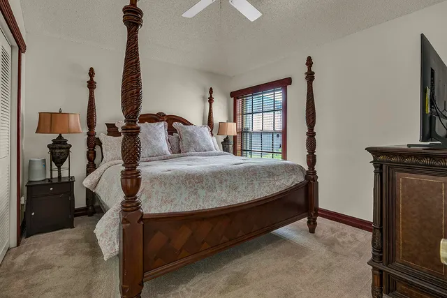 a kitchen with granite countertop a sink counter top space appliances and cabinets