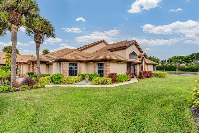 a view of a dining room with furniture wooden floor and chandelier