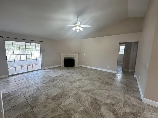 a view of an empty room with a window