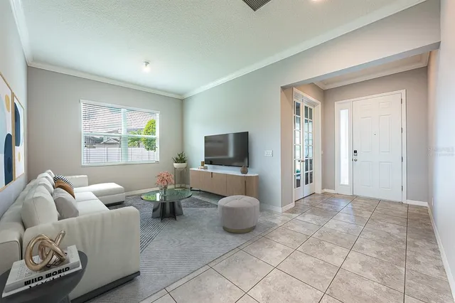 a living room with furniture and a window