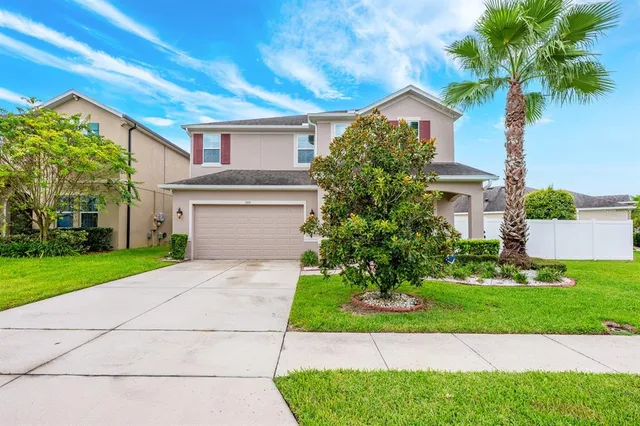 a view of a backyard with sitting area