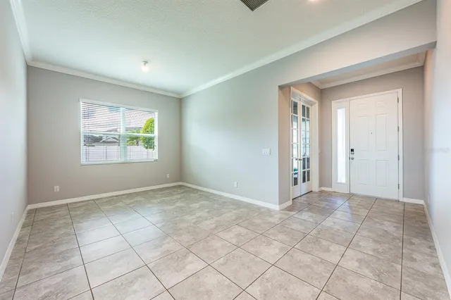 a view of an empty room with a window