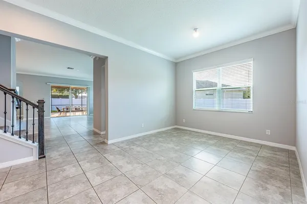 a view of an empty room with glass door