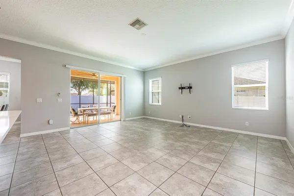 a view of empty room with a fireplace