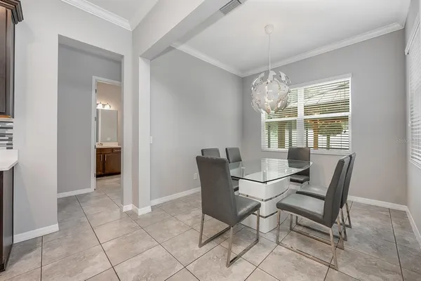a dining room with furniture and window