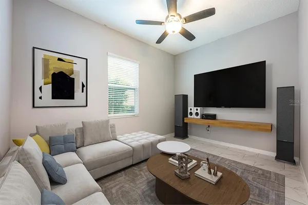 a living room with furniture and a flat screen tv