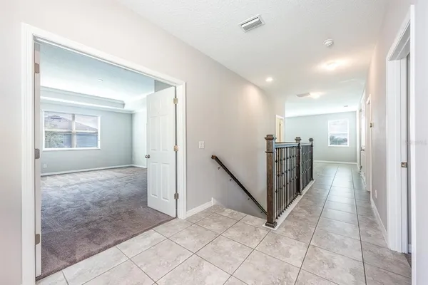 a view of a hallway with a bathroom