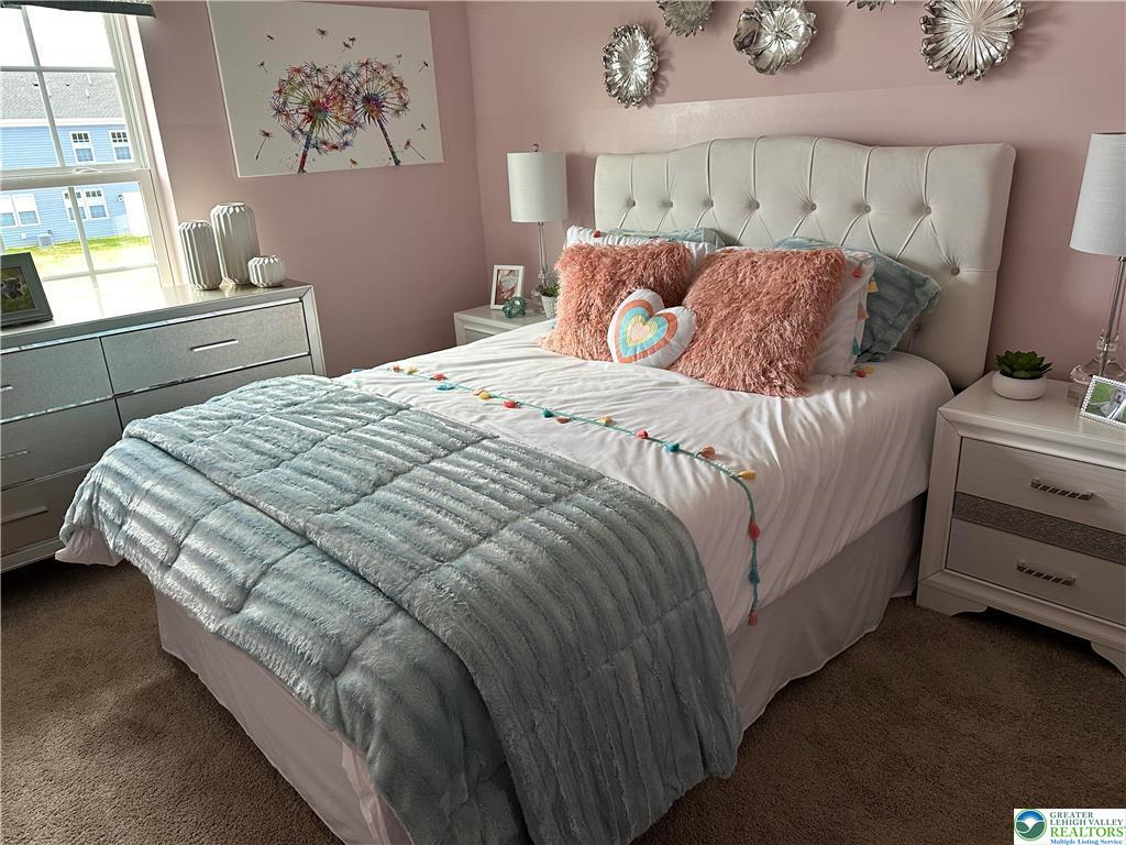 1145 Martin Road Breinigsville, PA 18031 - Photo 21 of 38 A well-appointed bedroom featuring ample natural light and plush carpeting.