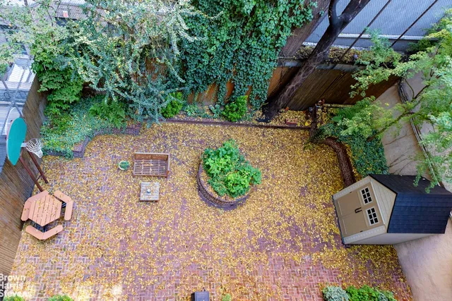 an aerial view of a house with garden space