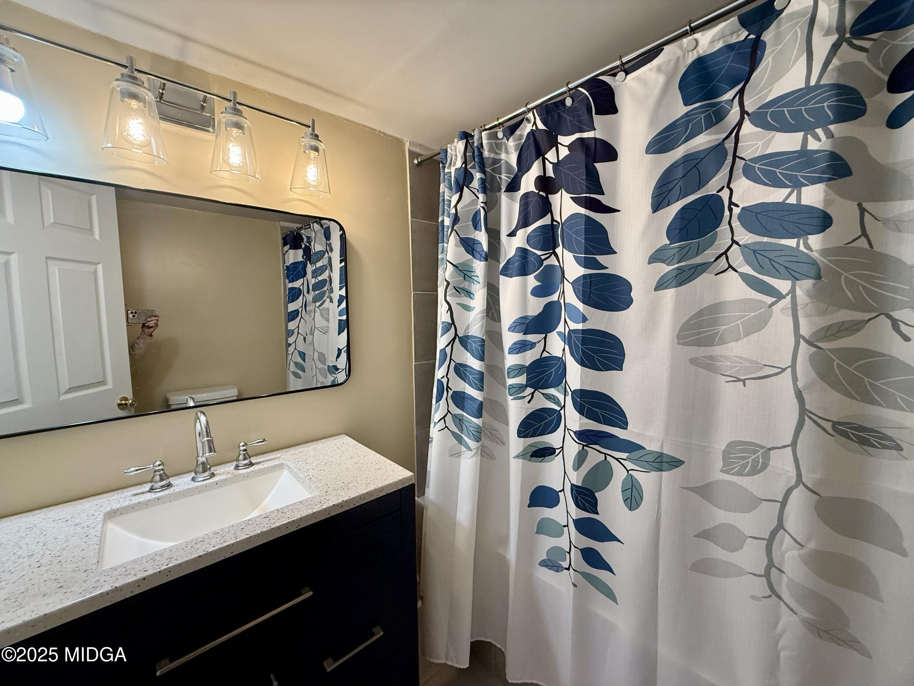 89 Springdale Road Jackson, GA 30233 - Photo 10 of 13 a bathroom with a sink and a mirror