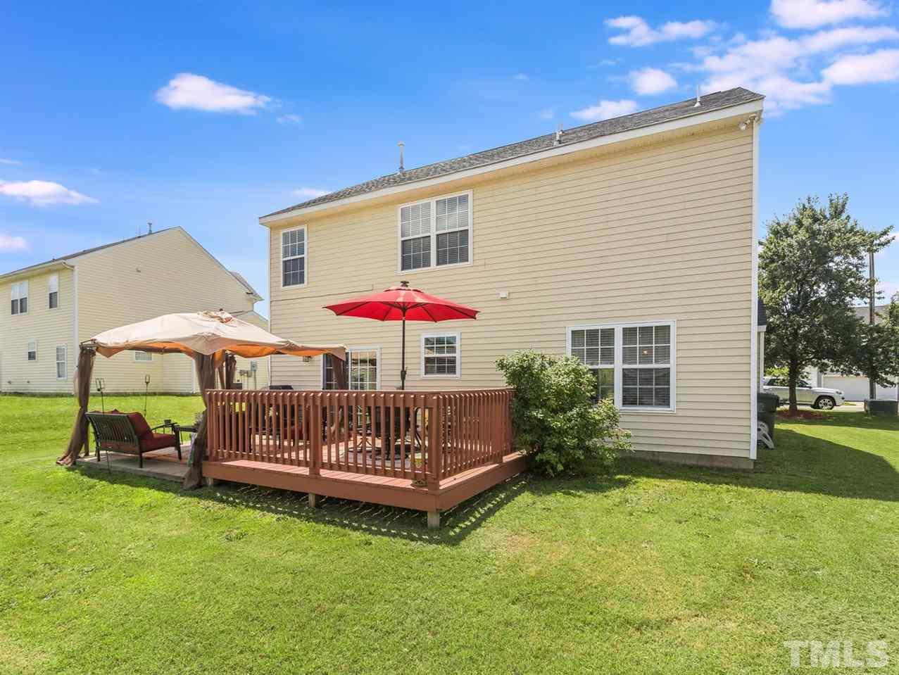 7021 Spanglers Spring Way Raleigh, NC 27610 - Photo 2 of 18 a front view of a house with garden