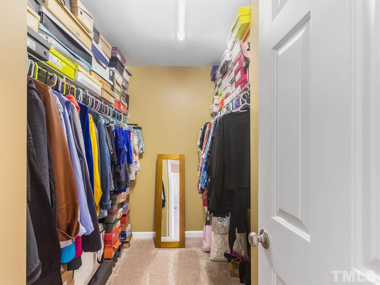 7021 Spanglers Spring Way Raleigh, NC 27610 - Photo 12 of 18 a view of walk in closet with clothes