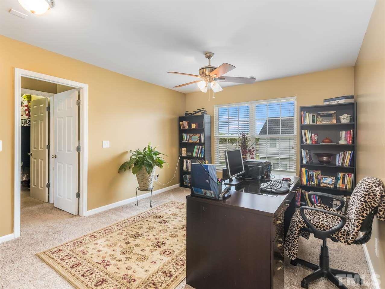 7021 Spanglers Spring Way Raleigh, NC 27610 - Photo 17 of 18 a living room with furniture and a rug