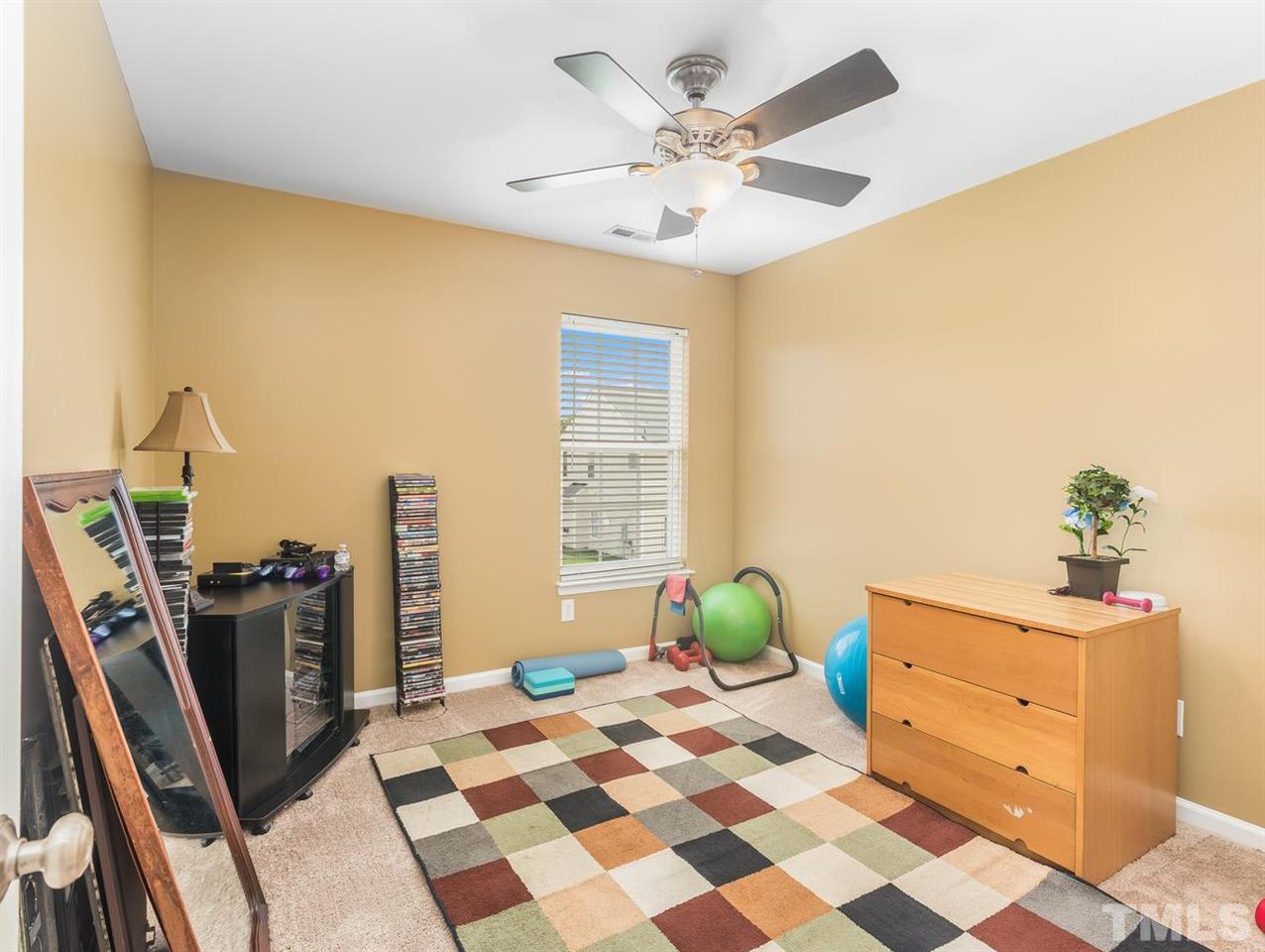 7021 Spanglers Spring Way Raleigh, NC 27610 - Photo 9 of 18 a view of a workspace with furniture and a window