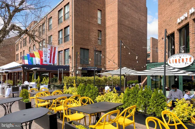 a view of a street with benches