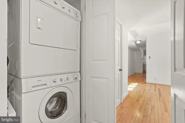 a view of a hallway with washer and dryer