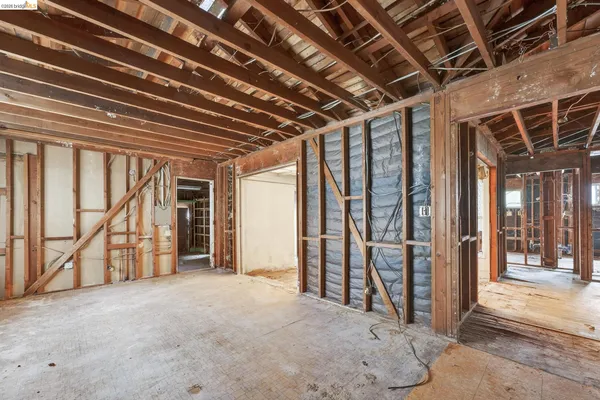 a view of an empty room with windows