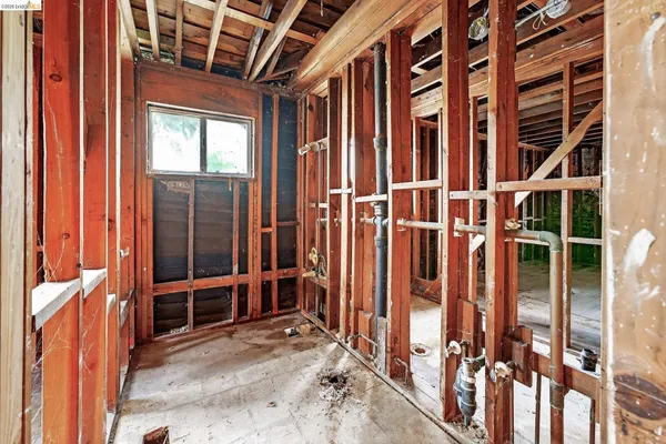 a view of an empty room with windows