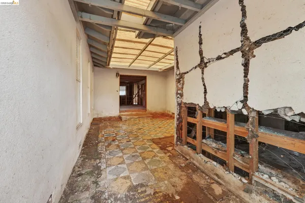 a view of a chairs and table in the patio