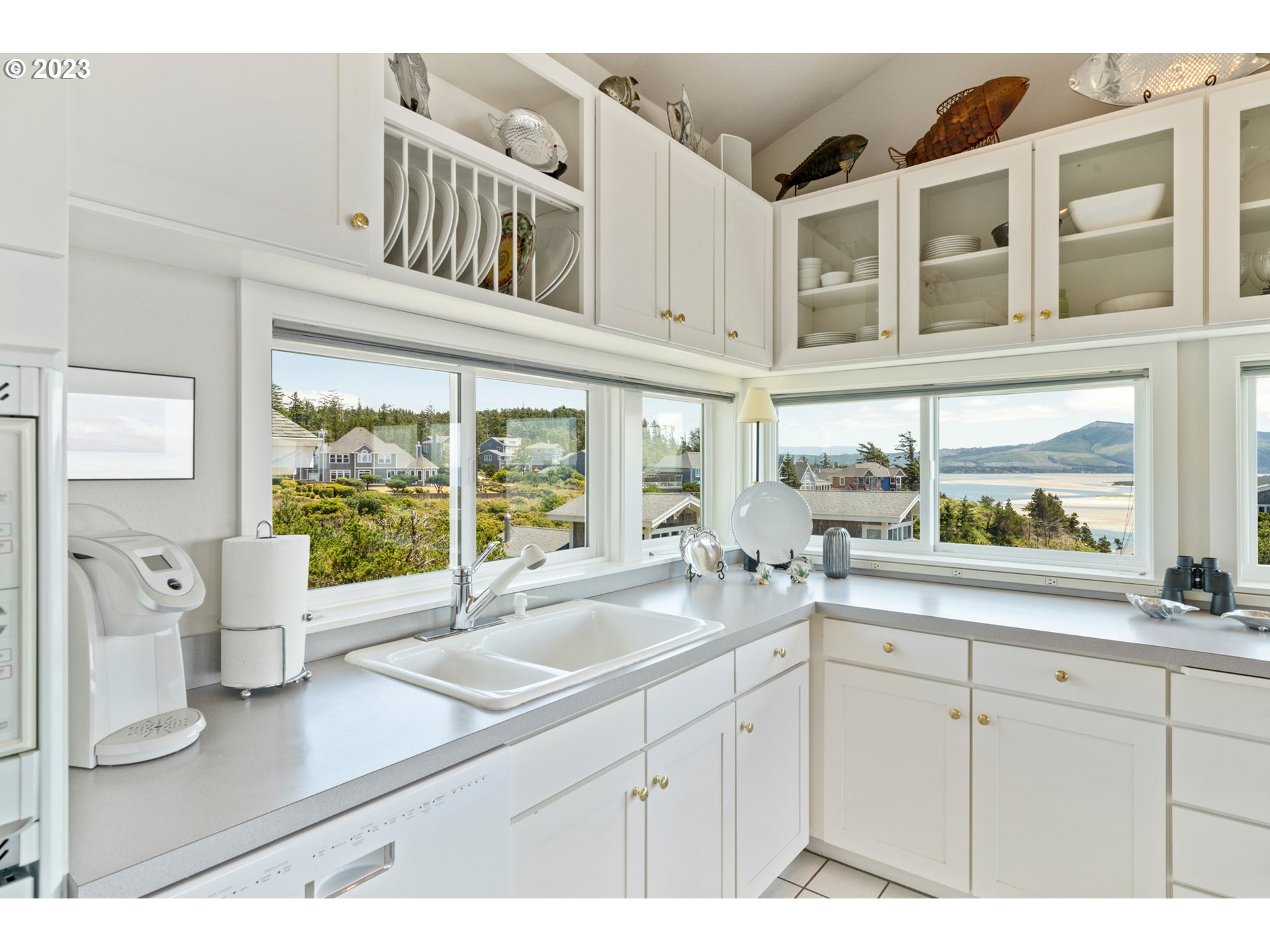 535 Capes Point Oceanside, OR 97141 - Photo 12 of 48 a kitchen with a sink and large cabinets