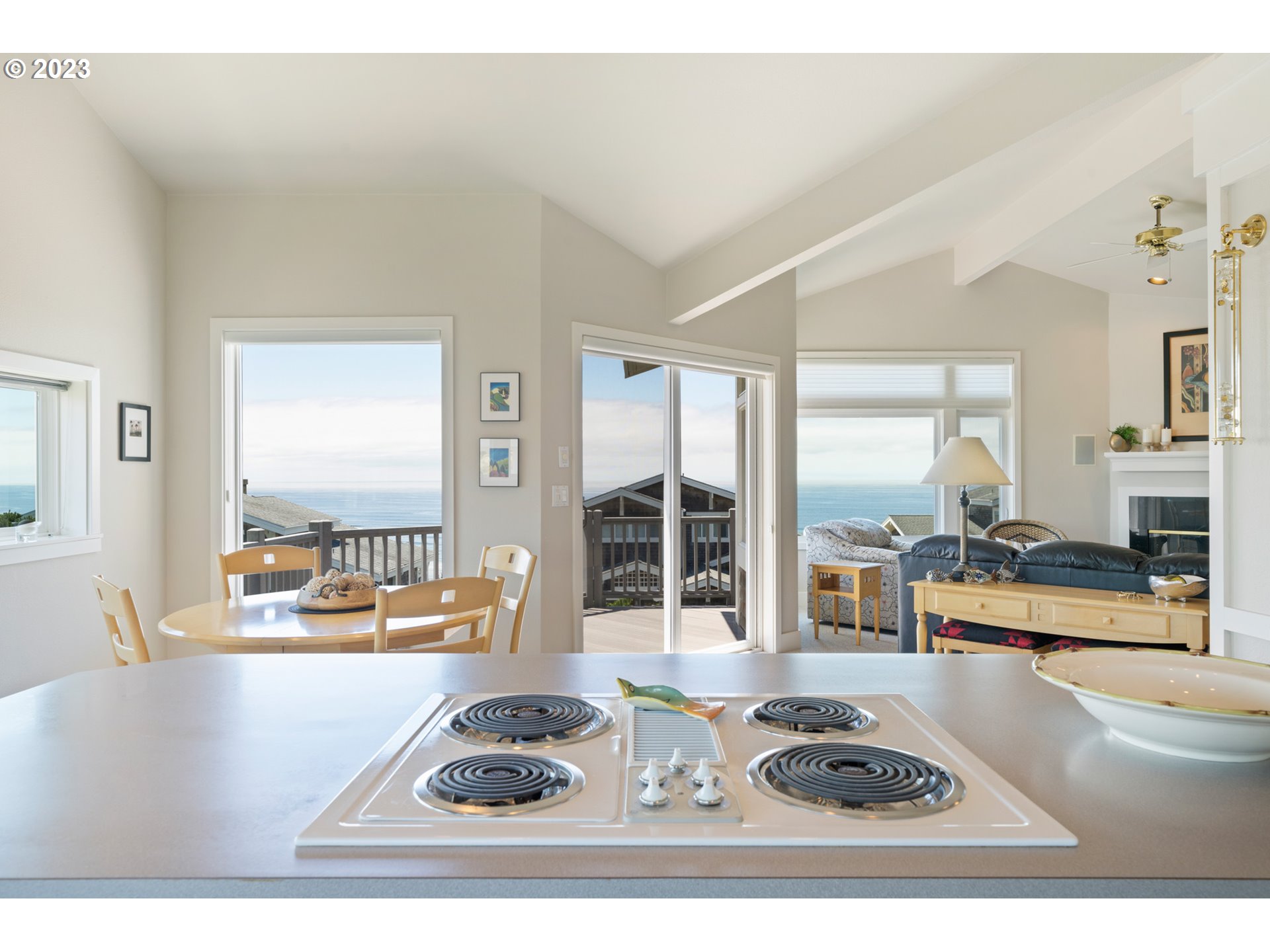 535 Capes Point Oceanside, OR 97141 - Photo 15 of 48 a living room with furniture stove and large window