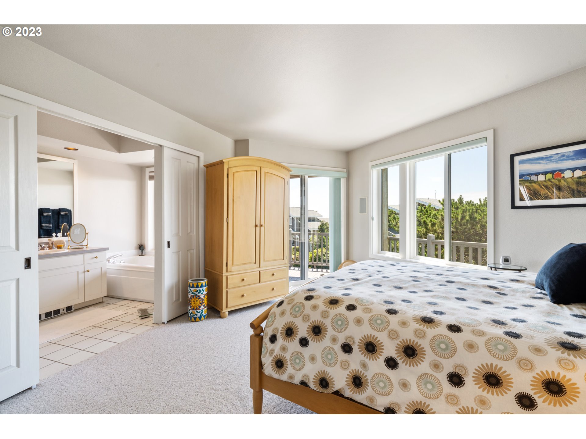 535 Capes Point Oceanside, OR 97141 - Photo 19 of 48 a bedroom with a bed and a window