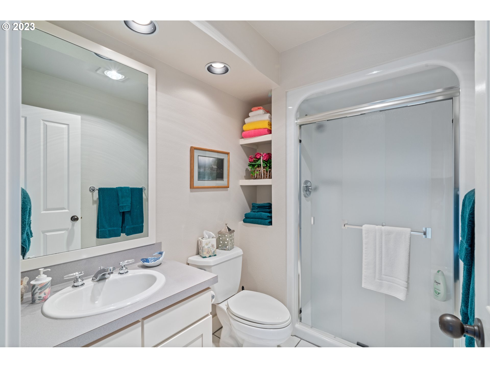 535 Capes Point Oceanside, OR 97141 - Photo 26 of 48 a bathroom with a sink vanity mirror and toilet
