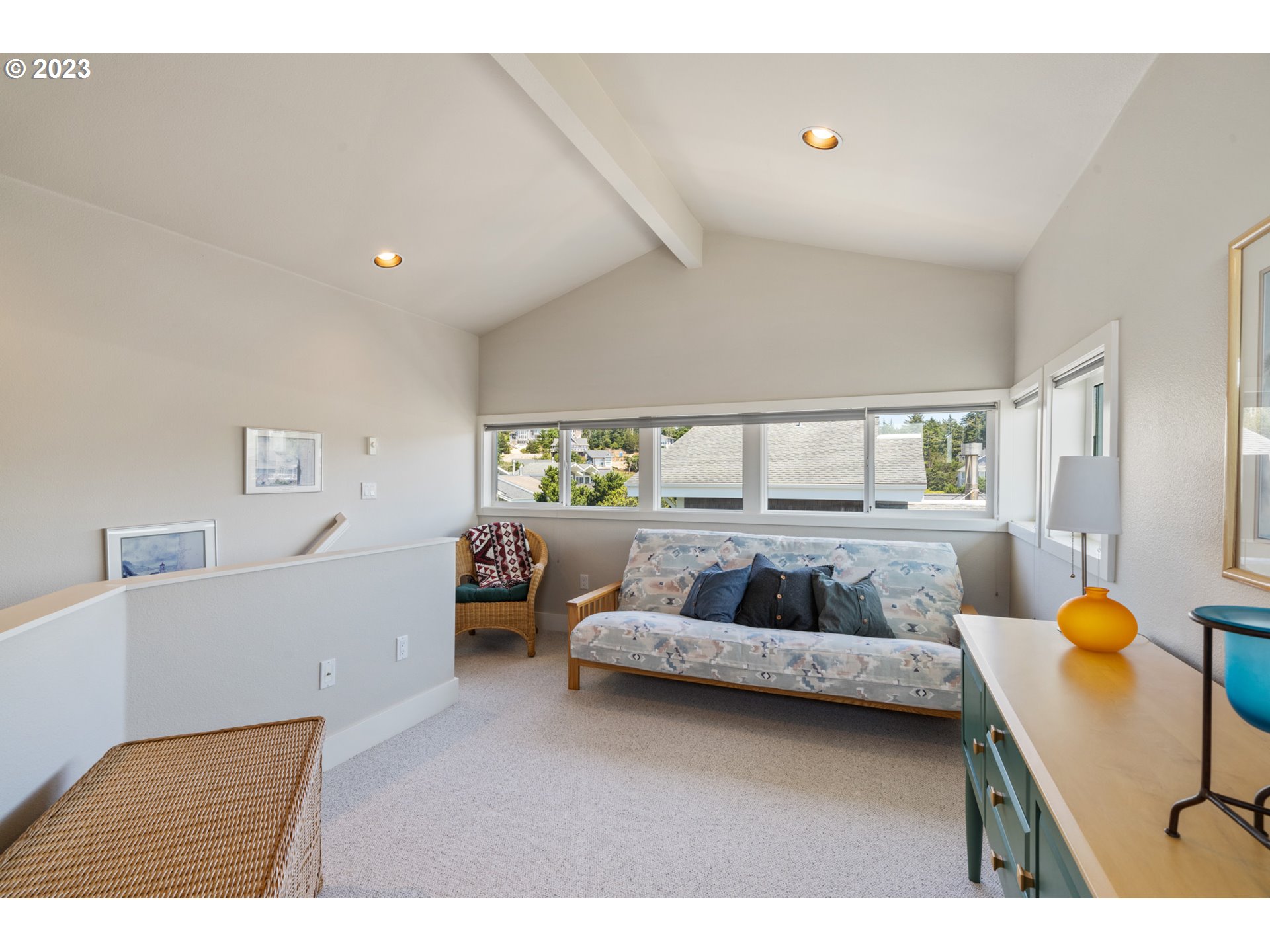 535 Capes Point Oceanside, OR 97141 - Photo 28 of 48 a living room with furniture and a large window