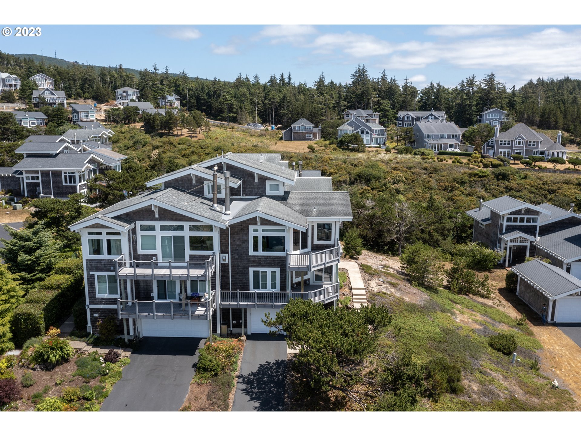 535 Capes Point Oceanside, OR 97141 - Photo 31 of 48 a aerial view of a house with a big yard