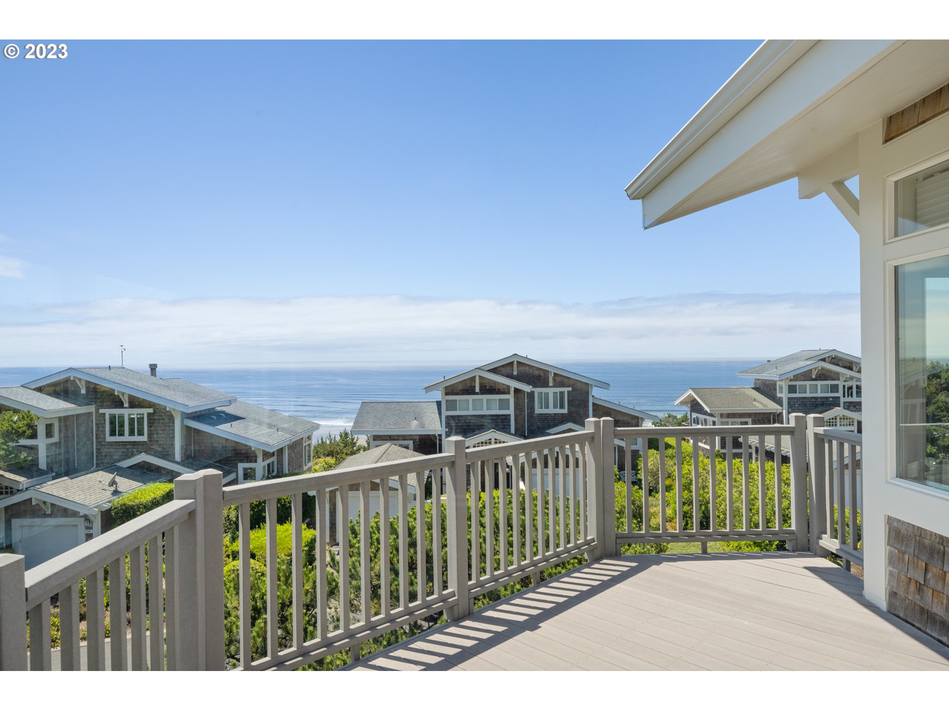535 Capes Point Oceanside, OR 97141 - Photo 40 of 48 a view of a city from a balcony