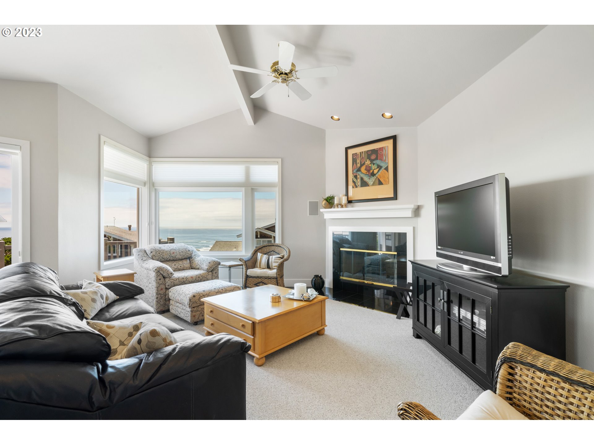 535 Capes Point Oceanside, OR 97141 - Photo 6 of 48 a living room with furniture and a flat screen tv