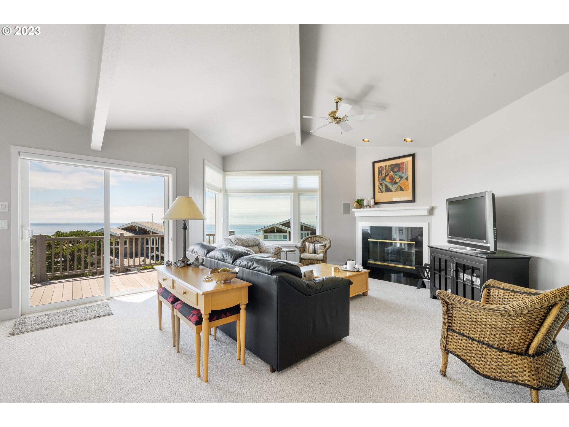 535 Capes Point Oceanside, OR 97141 - Photo 7 of 48 a living room with fireplace furniture and a flat screen tv