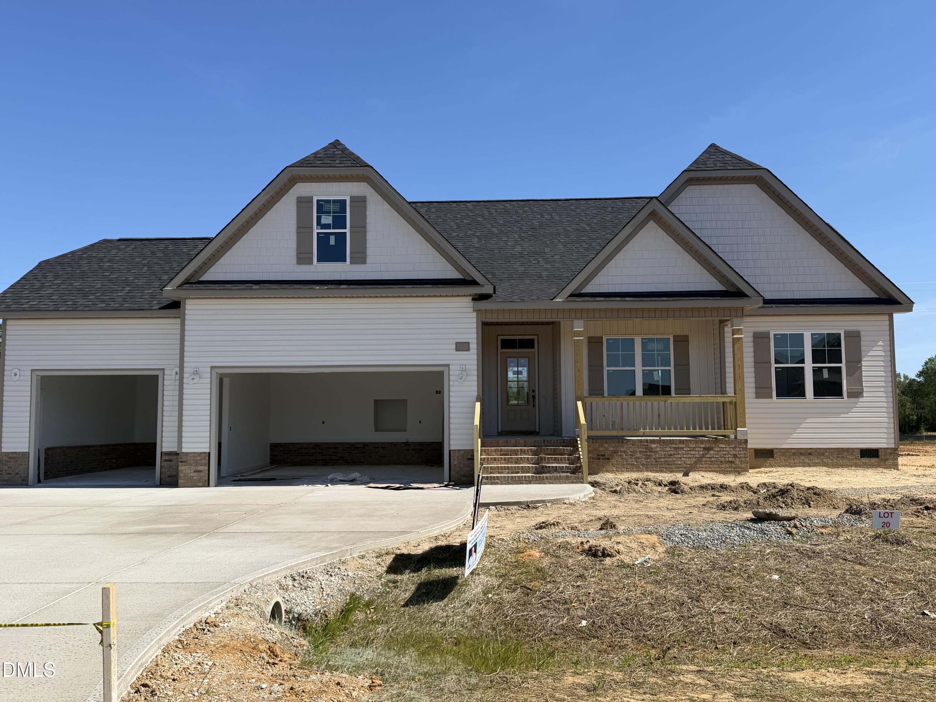 38 Charles Point Selma, NC 27576 - Photo 2 of 5 a front view of a house with garden