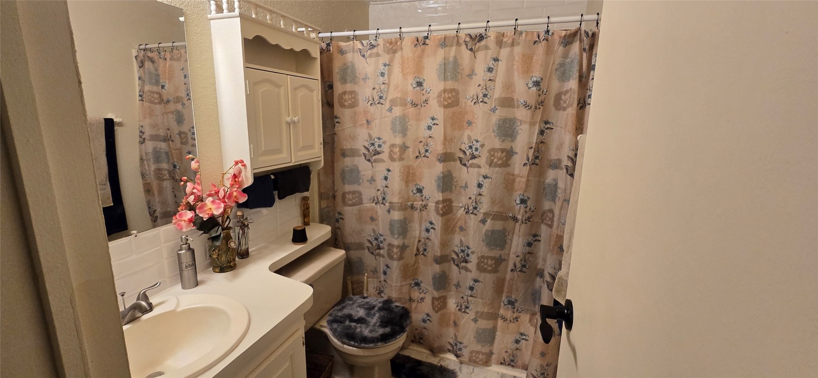 2002 Citation Drive Del Valle, TX 78617 - Photo 14 of 25 a bathroom with a sink toilet and shower