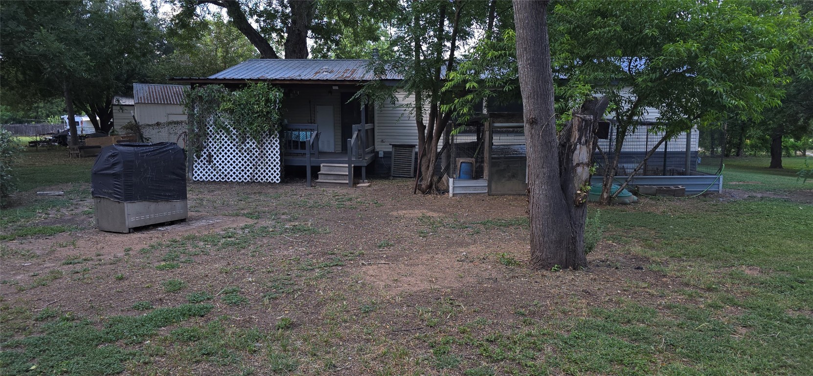 2002 Citation Drive Del Valle, TX 78617 - Photo 21 of 25 a view of a house with backyard and a tree