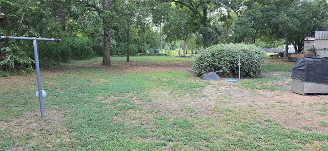 a backyard of a house with lots of green space