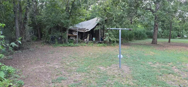 a view of a wooden deck and yard