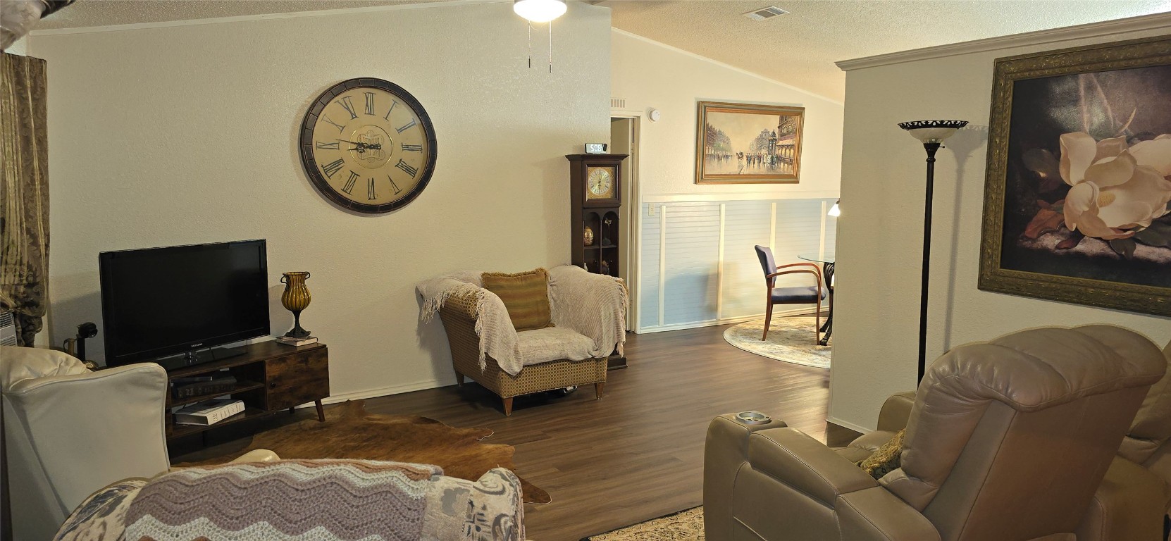2002 Citation Drive Del Valle, TX 78617 - Photo 9 of 25 a living room with furniture a flat screen tv and a wall painting