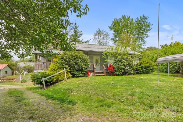 a view of a park with large trees