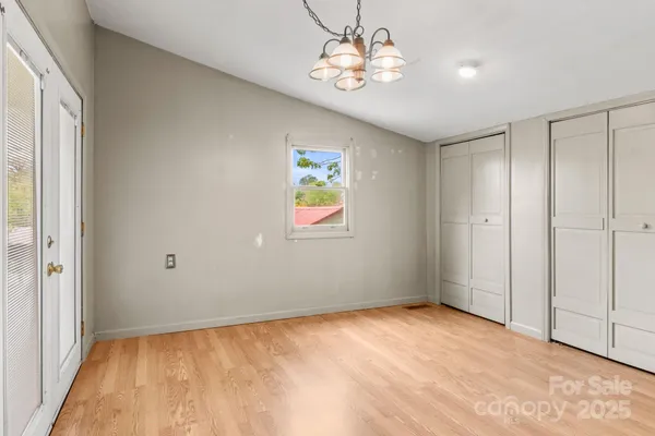 a view of an empty room with a window