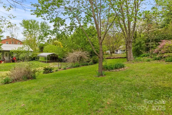 a view of backyard with green space