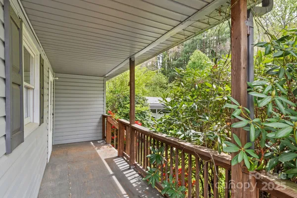 a view of a balcony with wooden floor